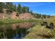 Scenic riverfront property with wooden benches, ideal for relaxation at 2677 S Platte River Rd, Sedalia, CO 80135