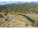 Aerial view of property showcasing riverfront lot and mountain views at 2677 S Platte River Rd, Sedalia, CO 80135