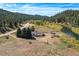 Riverfront property with home and outbuildings; mountain views at 2677 S Platte River Rd, Sedalia, CO 80135