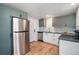 Modern kitchen with gray cabinets and stainless steel appliances at 2922 W 21St Ave, Denver, CO 80211