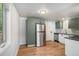 Modern kitchen with gray cabinets and stainless steel appliances at 2922 W 21St Ave, Denver, CO 80211