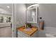 Modern bathroom with white vanity, subway tile shower, and wood countertop at 4845 Silver Spruce Ln, Evergreen, CO 80439