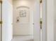 A hallway with two white doors and artwork at 1747 N Washington St # C306, Denver, CO 80203