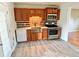 Modern kitchen with stainless steel appliances and wood cabinets at 3480 W 96Th Ave, Westminster, CO 80031