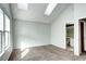 Bedroom with ensuite bathroom and skylights at 1233 S Flower Cir # B, Lakewood, CO 80232