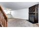 Living room featuring a wood-paneled fireplace at 1233 S Flower Cir # B, Lakewood, CO 80232