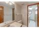 Clean bathroom with toilet, sink, and access to laundry at 2552 E 126Th Way, Thornton, CO 80241