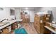Finished basement room with stacks of boxes and work tables at 1324 Shadow Mountain Dr, Highlands Ranch, CO 80126
