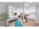 Finished basement with a bedroom, exercise bike, and kitchenette at 1324 Shadow Mountain Dr, Highlands Ranch, CO 80126