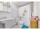 Basement bathroom with shower, toilet and small vanity at 1324 Shadow Mountain Dr, Highlands Ranch, CO 80126