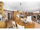 Kitchen features a spacious dining area with wood flooring at 1324 Shadow Mountain Dr, Highlands Ranch, CO 80126