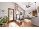 Gathering room with a cozy fireplace and hardwood floors at 1324 Shadow Mountain Dr, Highlands Ranch, CO 80126