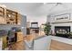 Home office features built-in shelving, a desk, and views into the Gathering room at 1324 Shadow Mountain Dr, Highlands Ranch, CO 80126