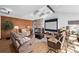 Spacious living room with vaulted ceilings, a stone fireplace, and a projector at 1324 Shadow Mountain Dr, Highlands Ranch, CO 80126