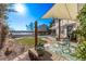 Patio with shade sail, seating, and scenic views at 1324 Shadow Mountain Dr, Highlands Ranch, CO 80126