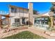 Backyard patio with shade sail and seating area at 1324 Shadow Mountain Dr, Highlands Ranch, CO 80126