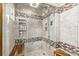 Large walk-in shower with tiled walls and built-in seat at 1324 Shadow Mountain Dr, Highlands Ranch, CO 80126