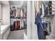 Large walk-in closet with ample hanging space and shelving at 1324 Shadow Mountain Dr, Highlands Ranch, CO 80126