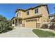 Two-story house with beige siding, stone accents, and a front porch at 1512 Lasalle Way, Longmont, CO 80504