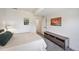 Bright basement bedroom with a queen-size bed and built-in media console at 347 Felicity Loop, Castle Rock, CO 80109