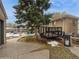 Backyard with concrete patio and large tree at 300 S Simms St, Lakewood, CO 80228