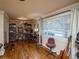 Bright home office features built-in shelving and hardwood floors at 300 S Simms St, Lakewood, CO 80228