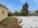 Large backyard with partial snow cover at 300 S Simms St, Lakewood, CO 80228