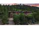 Luxury home exterior at dusk, showcasing landscaping and mountain views at 1420 Sierra Dr, Boulder, CO 80302