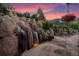 Peaceful patio with a gorgeous waterfall backdrop at sunset at 1420 Sierra Dr, Boulder, CO 80302