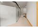 Basement hallway with glass partitions and access to spa and kitchenette at 1420 Sierra Dr, Boulder, CO 80302