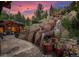 Serene backyard oasis featuring a multi-tiered waterfall and patio area at 1420 Sierra Dr, Boulder, CO 80302