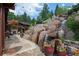 Waterfall feature with stonework and lush landscaping at 1420 Sierra Dr, Boulder, CO 80302