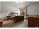 Basement bedroom with rustic wooden bed and ample natural light at 1420 Sierra Dr, Boulder, CO 80302