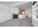 Living room with fireplace and kitchen view at 729 Snowberry St, Longmont, CO 80503