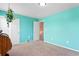 Bedroom with light teal walls, double doors and access to upstairs hallway at 463 N Jamestown Way, Aurora, CO 80018