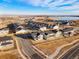 Community overview showcasing numerous houses and a lake at 9359 Russell Cir, Arvada, CO 80007