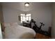 Bright bedroom with hardwood floors, a double bed, and home office area at 1881 S Saint Paul St, Denver, CO 80210