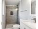 Updated bathroom with a walk-in shower and modern vanity at 8286 E Girard Ave, Denver, CO 80231