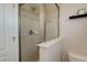 Clean bathroom with a shower and shelf for toiletries at 2311 Decatur St, Denver, CO 80211