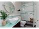 Updated bathroom with walk-in shower and modern vanity at 2311 Decatur St, Denver, CO 80211