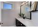 Powder room with single vanity and modern fixtures at 2311 Decatur St, Denver, CO 80211