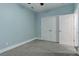 Spacious bedroom with light blue walls and double doors at 2311 Decatur St, Denver, CO 80211