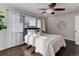 Spacious bedroom with ceiling fan and hardwood floors at 2311 Decatur St, Denver, CO 80211