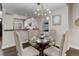 Open concept dining area with a glass table and four chairs at 2311 Decatur St, Denver, CO 80211