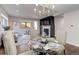 Dining area with glass table and seating for four, open floor plan at 2311 Decatur St, Denver, CO 80211
