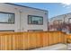 Exterior view of the building and wooden fence at 2311 Decatur St, Denver, CO 80211