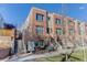 Attractive three-story townhome with brick exterior and landscaping at 2311 Decatur St, Denver, CO 80211