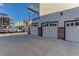Rear view of attached garages with ample parking at 2311 Decatur St, Denver, CO 80211