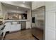 Modern kitchen, stainless steel appliances, farmhouse sink, hardwood floors at 2311 Decatur St, Denver, CO 80211