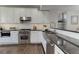 Modern kitchen with stainless steel appliances and granite countertops at 2311 Decatur St, Denver, CO 80211